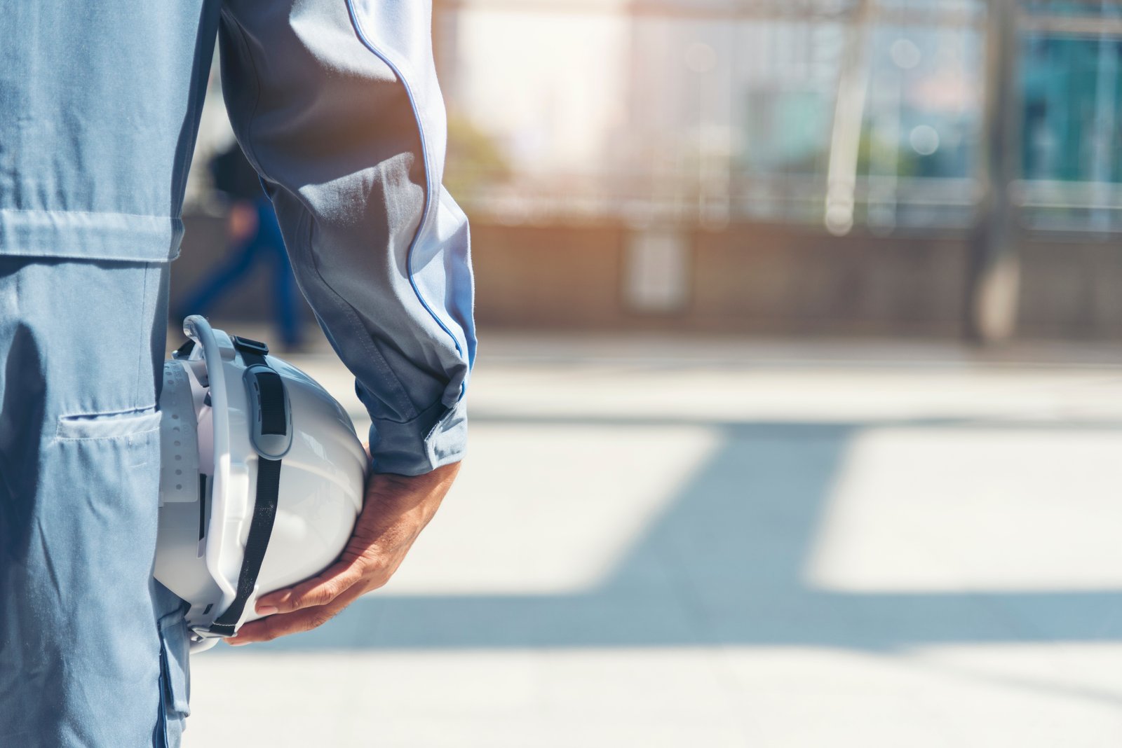 Photo of a maintenance engineer holding a hard hat