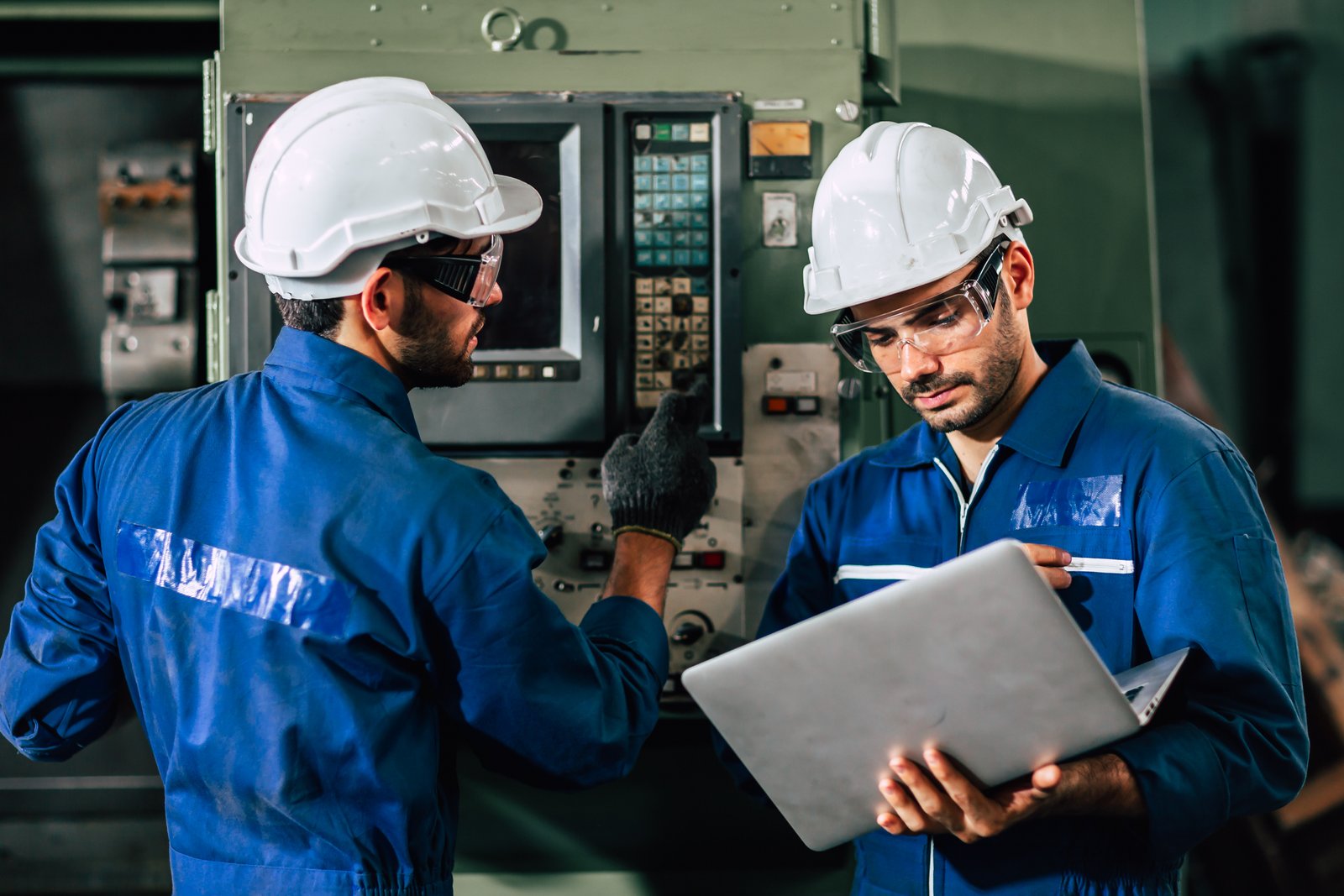 two engineers looking at a hmi
