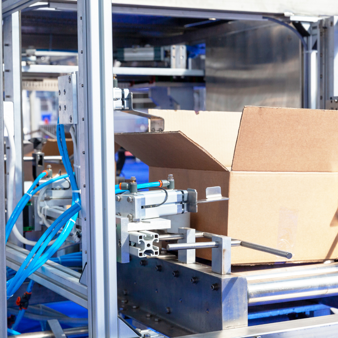 Manufacturing machine making cardboard boxes on a shift