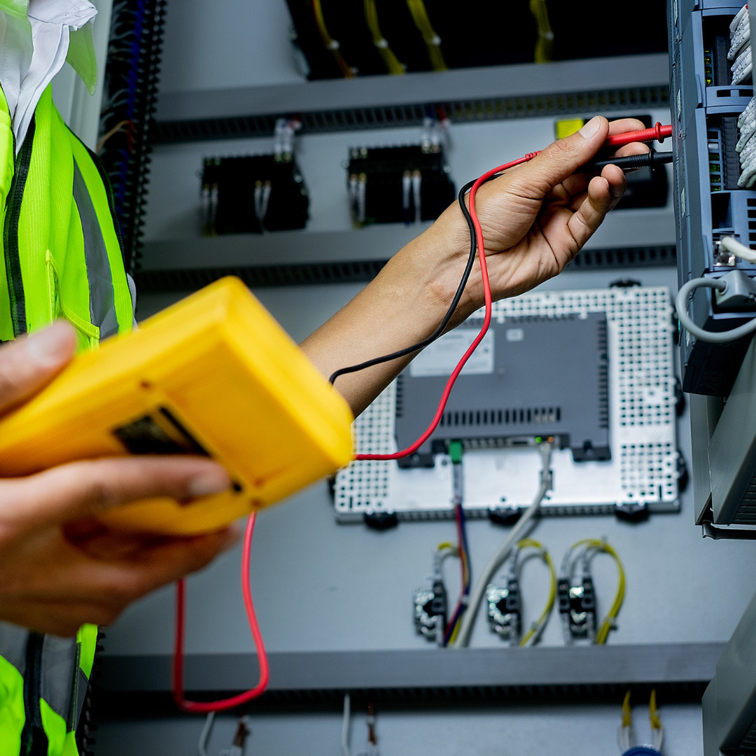 Photo showing an electrical engineer fixing a maintenance issue